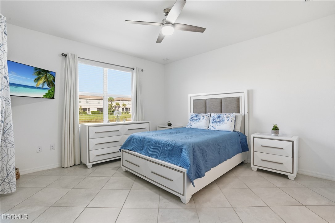 2617 Vine Avenue Naples, FL 34120 - Photo 15 of 27 a bedroom with a bed and a cabinets