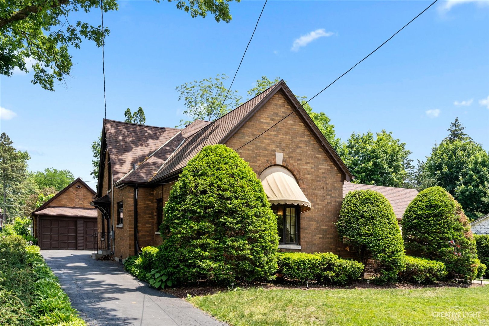 1125 Cedar Avenue Elgin, IL 60120 - Photo 2 of 29 a front view of a house with garden