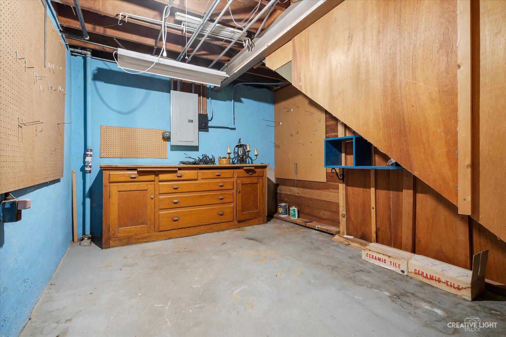 1125 Cedar Avenue Elgin, IL 60120 - Photo 23 of 29 a storage room with wooden cabinet
