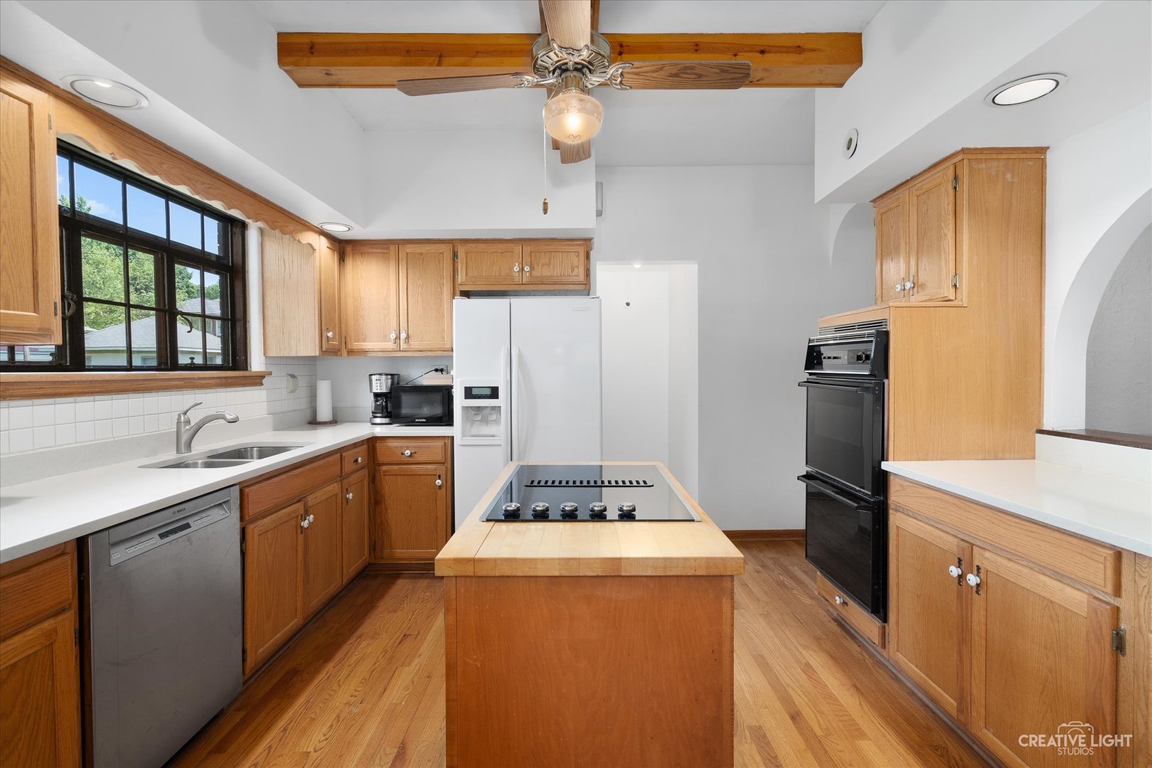 1125 Cedar Avenue Elgin, IL 60120 - Photo 9 of 29 a kitchen with a sink stove and refrigerator