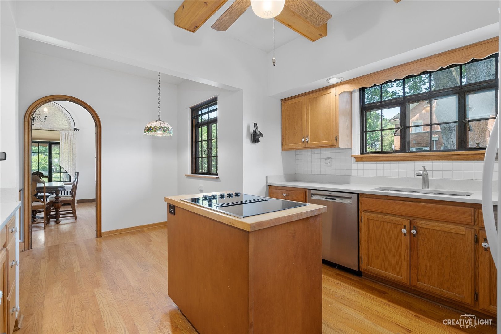 1125 Cedar Avenue Elgin, IL 60120 - Photo 10 of 29 a kitchen with sink cabinets and wooden floor