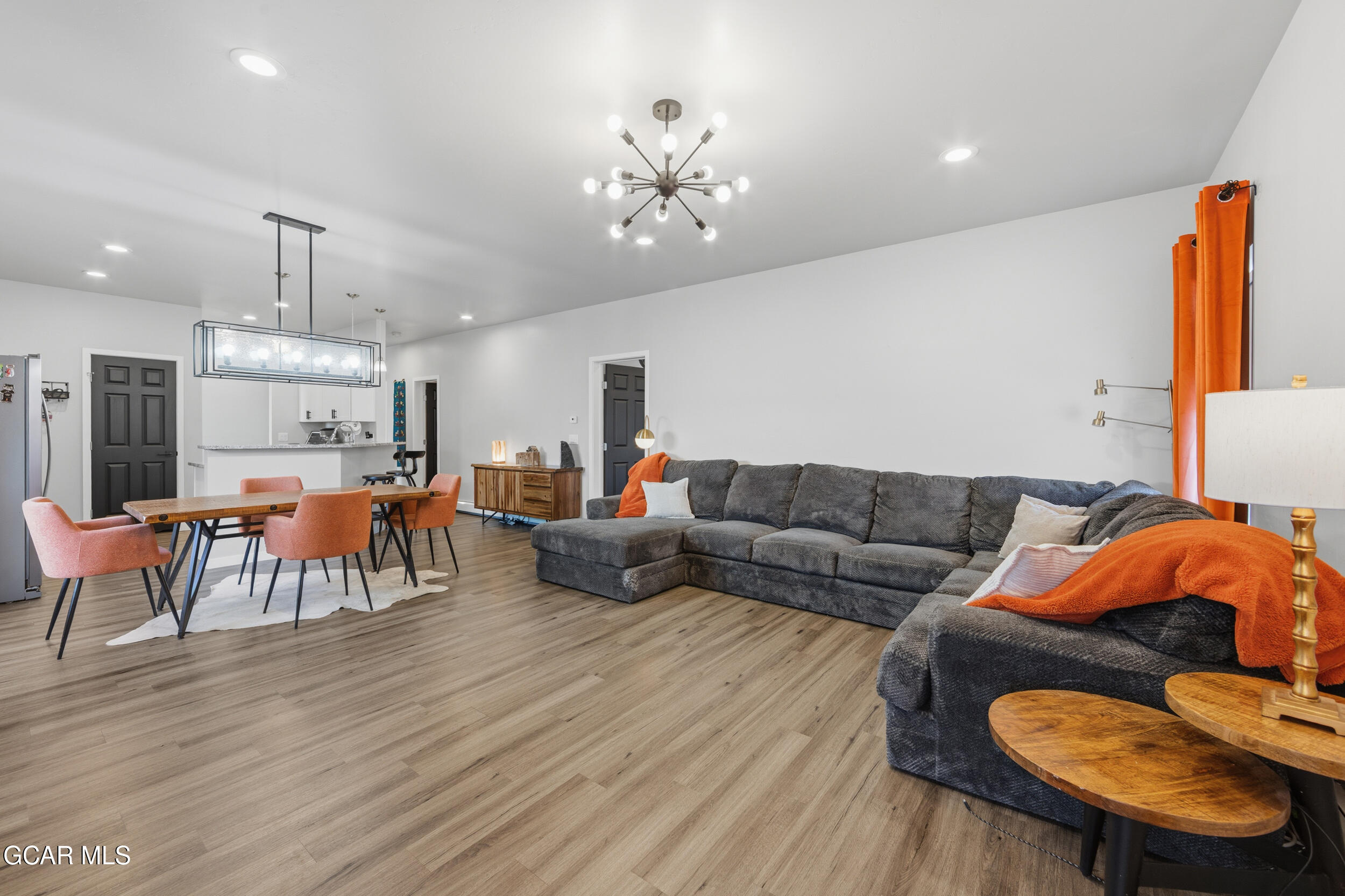 503 12th Street, Unit B Kremmling, CO 80459 - Photo 4 of 44 a living room with furniture and a chandelier