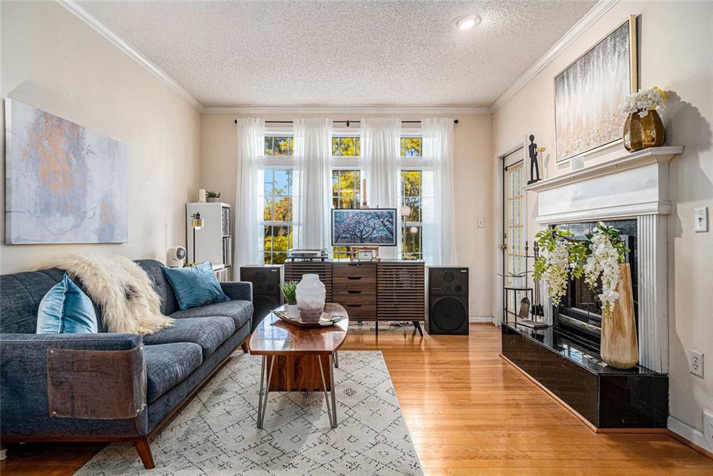 a living room with furniture and a fireplace
