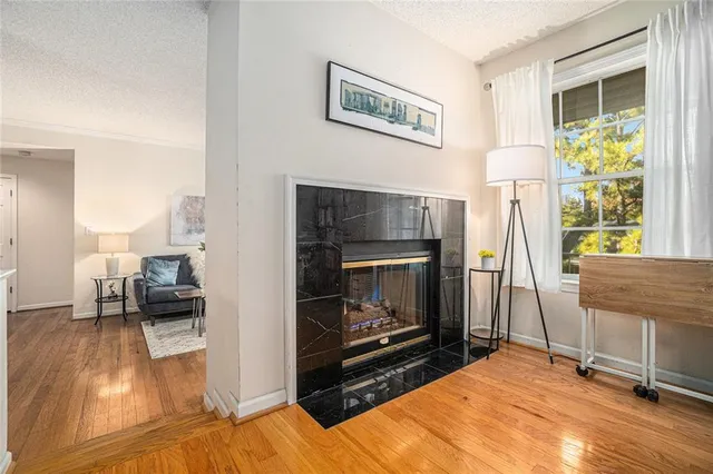 a bedroom with furniture and a fireplace