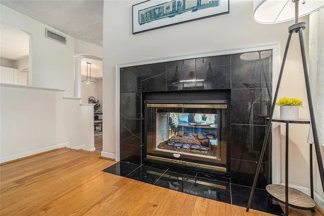 a bedroom with a bed and a fireplace