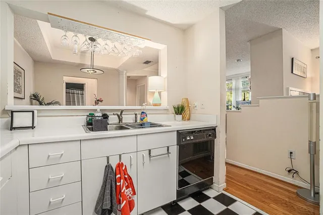 a spacious bathroom with a sink a mirror and a shower