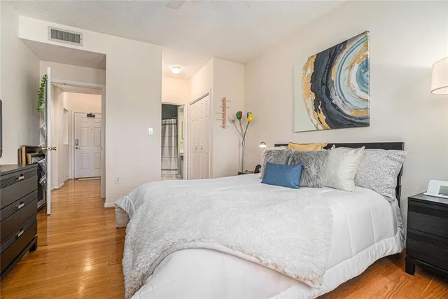 a spacious bedroom with a bed and a couch