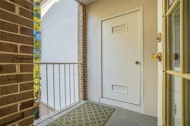 a view of a door and a window