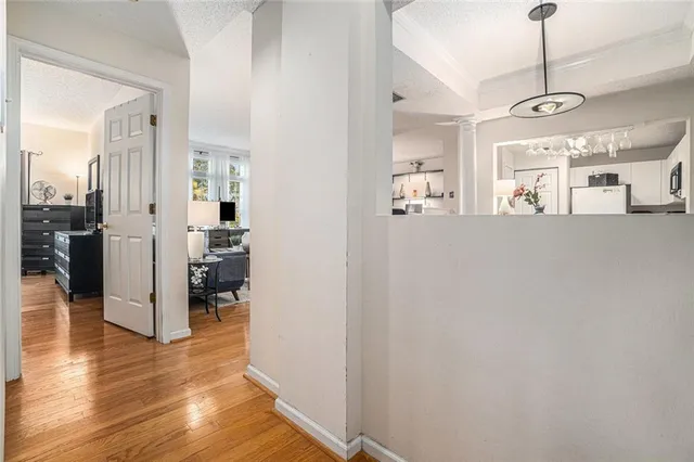 a view of a kitchen from the hallway