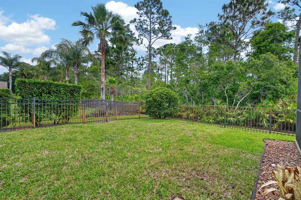 1269 Harwick Lane Ormond Beach, FL 32174 - Photo 35 of 39 a view of a backyard with a garden
