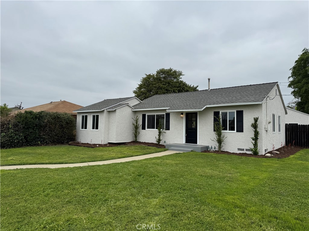 459 Pamela Road Duarte, CA 91010 - Photo 2 of 18 a house that is sitting in the grass with large trees