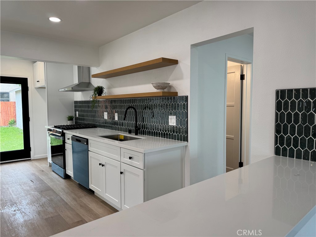 459 Pamela Road Duarte, CA 91010 - Photo 5 of 18 a kitchen with stainless steel appliances granite countertop a refrigerator and a stove top oven