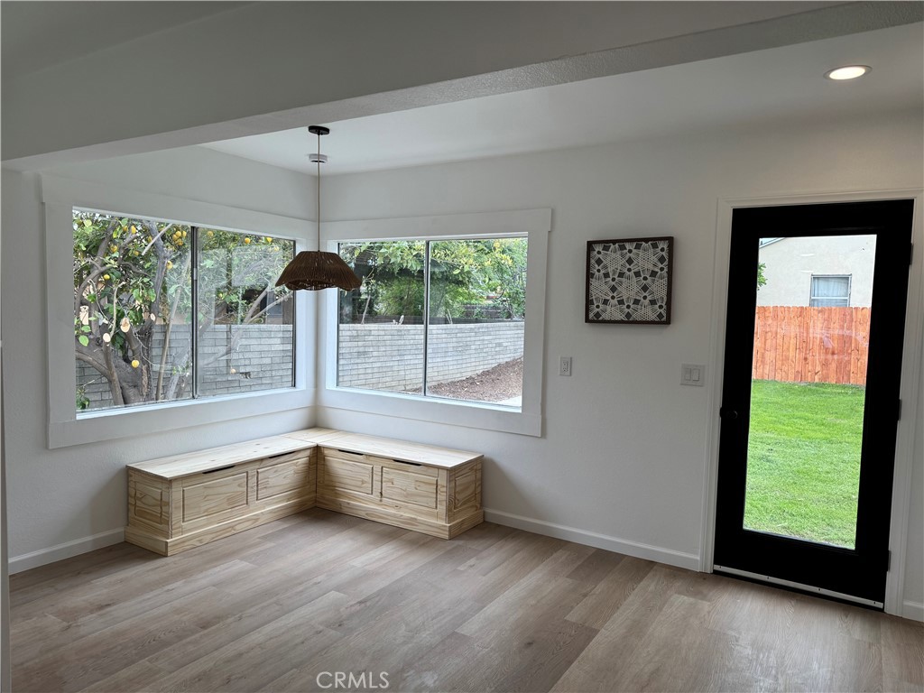 459 Pamela Road Duarte, CA 91010 - Photo 6 of 18 a view of an empty room with a window and wooden floor