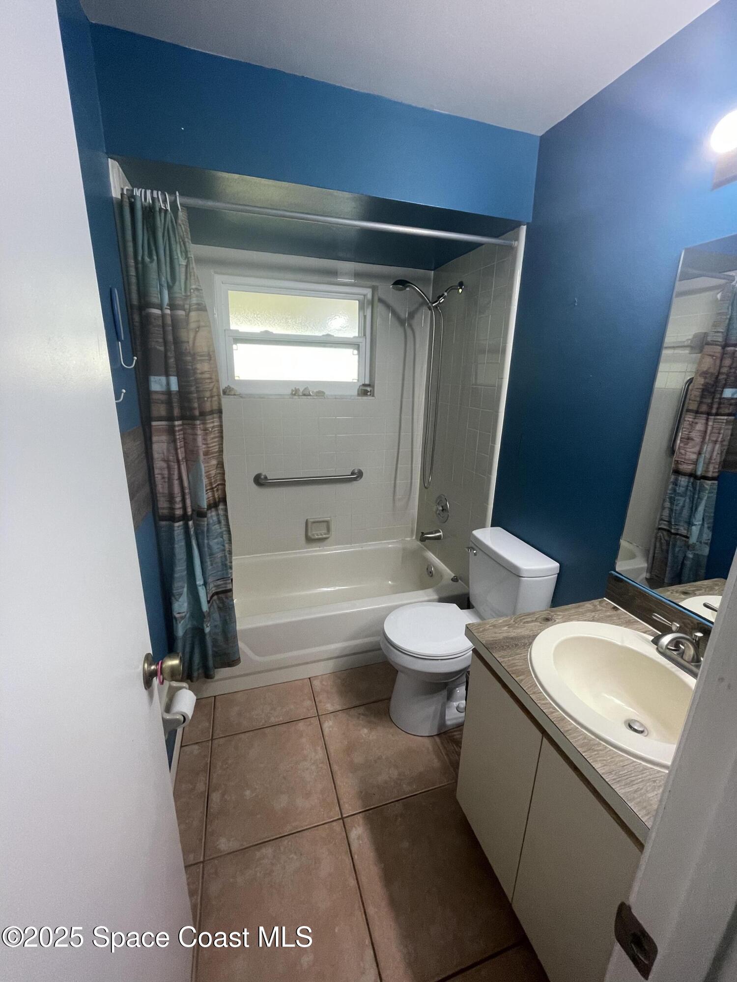 906 Black Pine Court Rockledge, FL 32955 - Photo 15 of 27 a bathroom with a granite countertop sink toilet and shower
