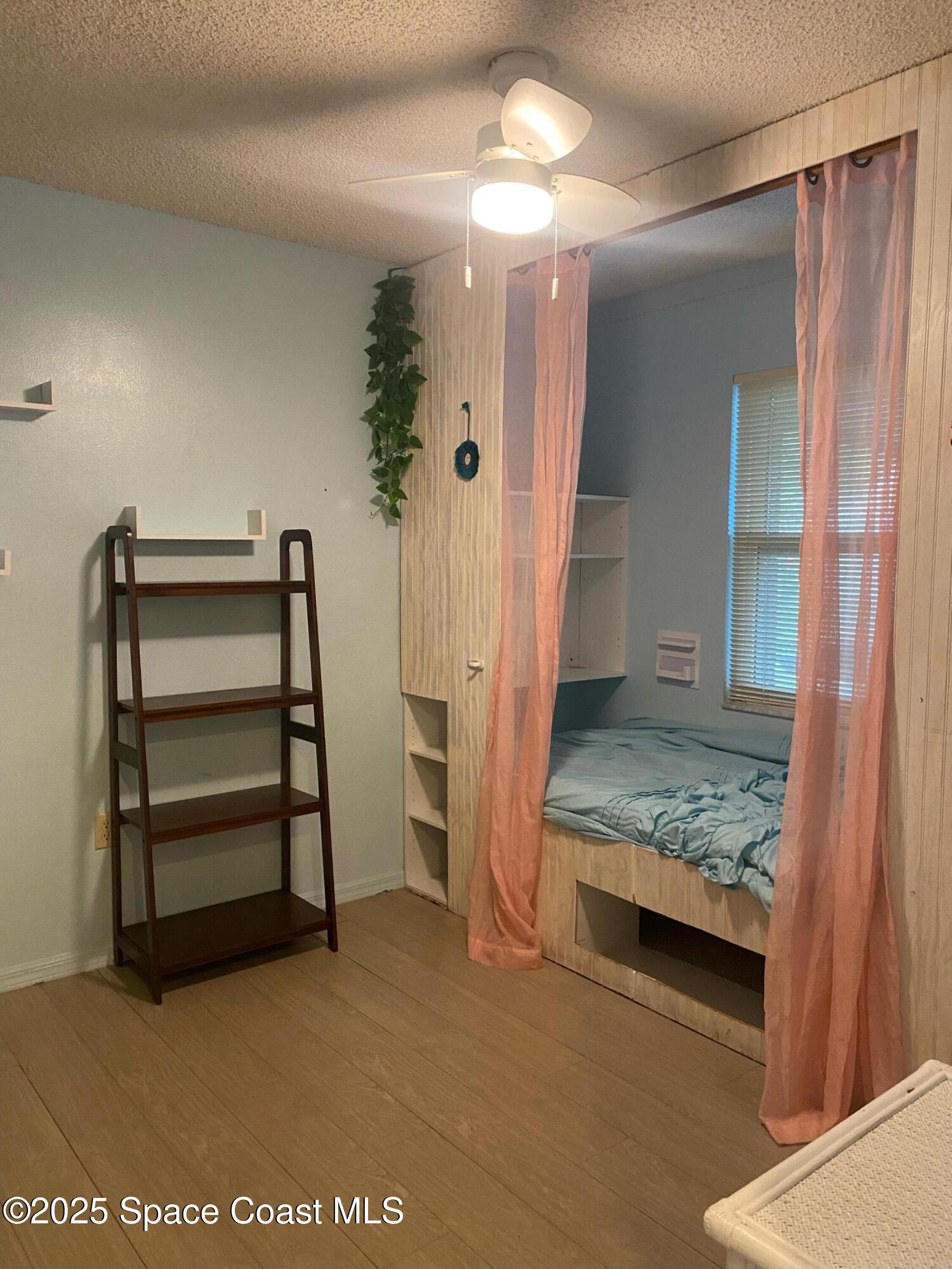 906 Black Pine Court Rockledge, FL 32955 - Photo 17 of 27 a view of an empty room with stairs and furniture