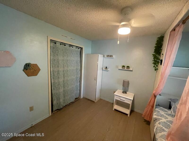 906 Black Pine Court Rockledge, FL 32955 - Photo 18 of 27 a room with a door open to a room