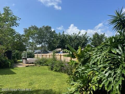 906 Black Pine Court Rockledge, FL 32955 - Photo 26 of 27 a front view of a house with a yard and a fountain
