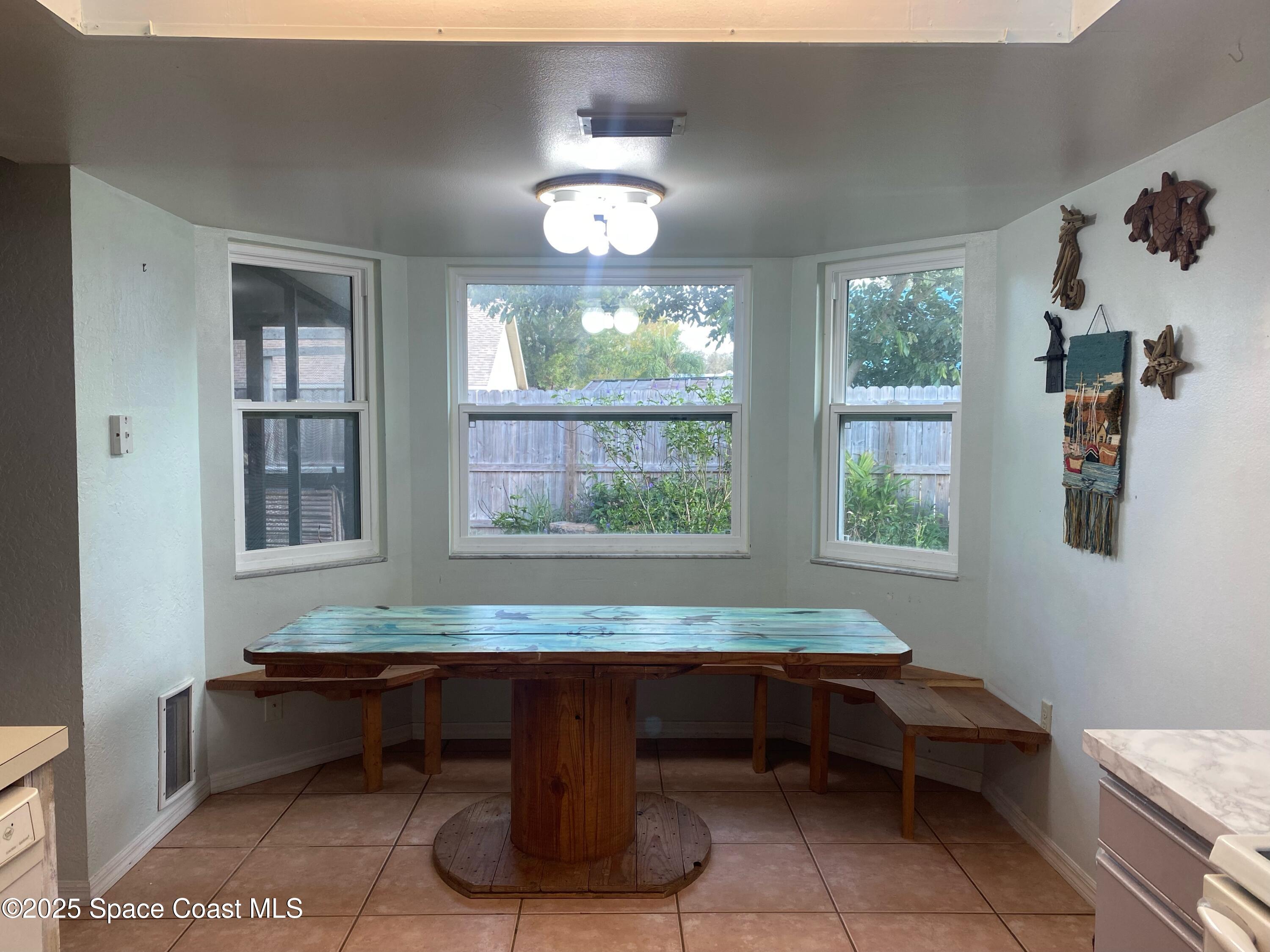 906 Black Pine Court Rockledge, FL 32955 - Photo 5 of 27 a room with pool table and windows