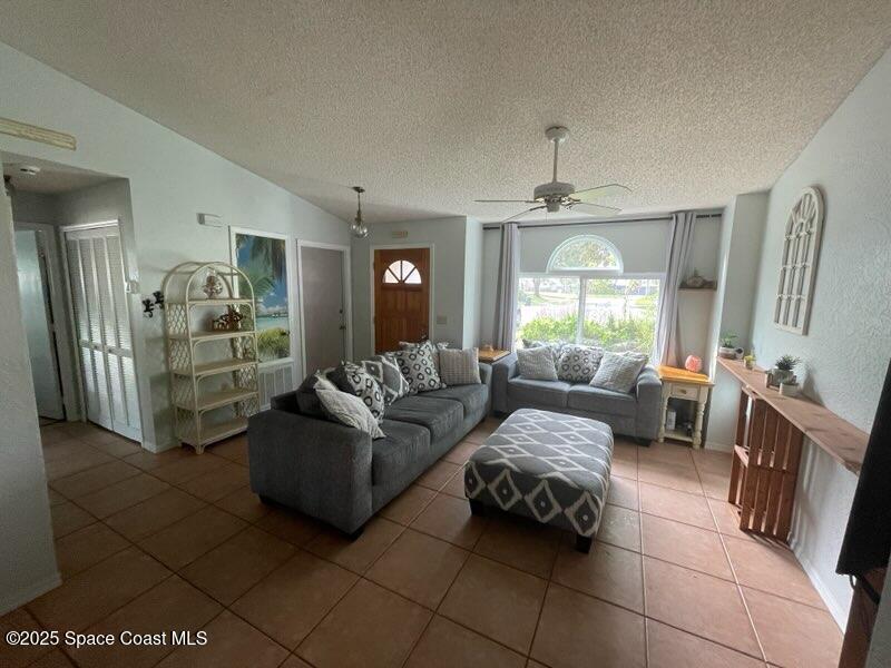 906 Black Pine Court Rockledge, FL 32955 - Photo 6 of 27 a living room with furniture and a window