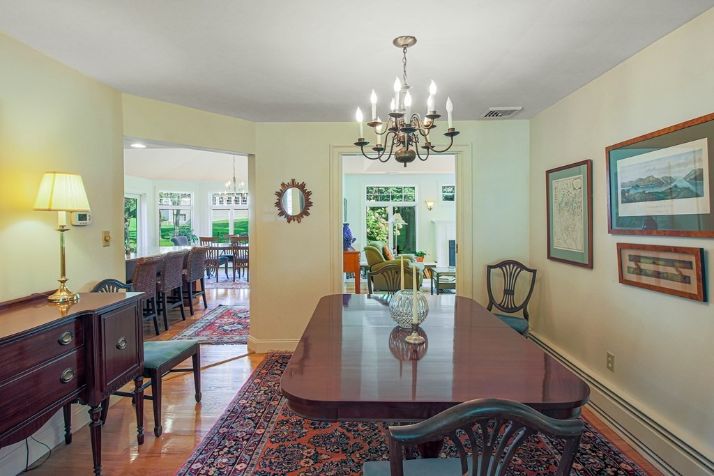 54 Ellis Drive Worcester, MA 01609 - Photo 13 of 42 a view of a dining room with furniture and chandelier