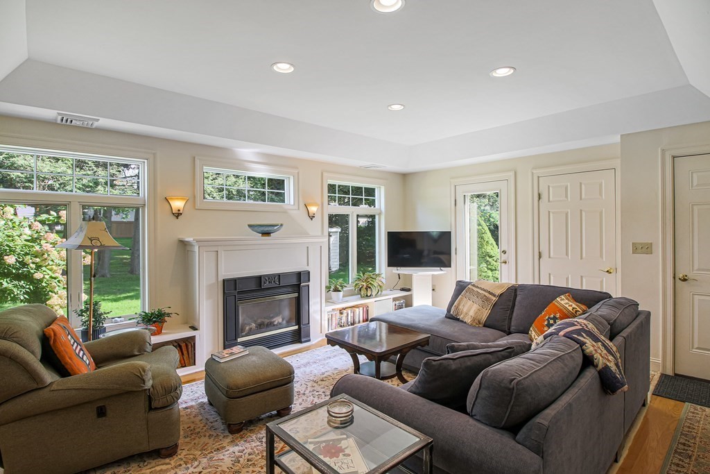 54 Ellis Drive Worcester, MA 01609 - Photo 15 of 42 a living room with furniture and a fireplace
