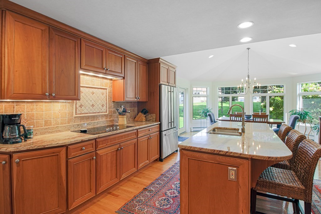 54 Ellis Drive Worcester, MA 01609 - Photo 19 of 42 a kitchen with stainless steel appliances granite countertop sink stove and refrigerator
