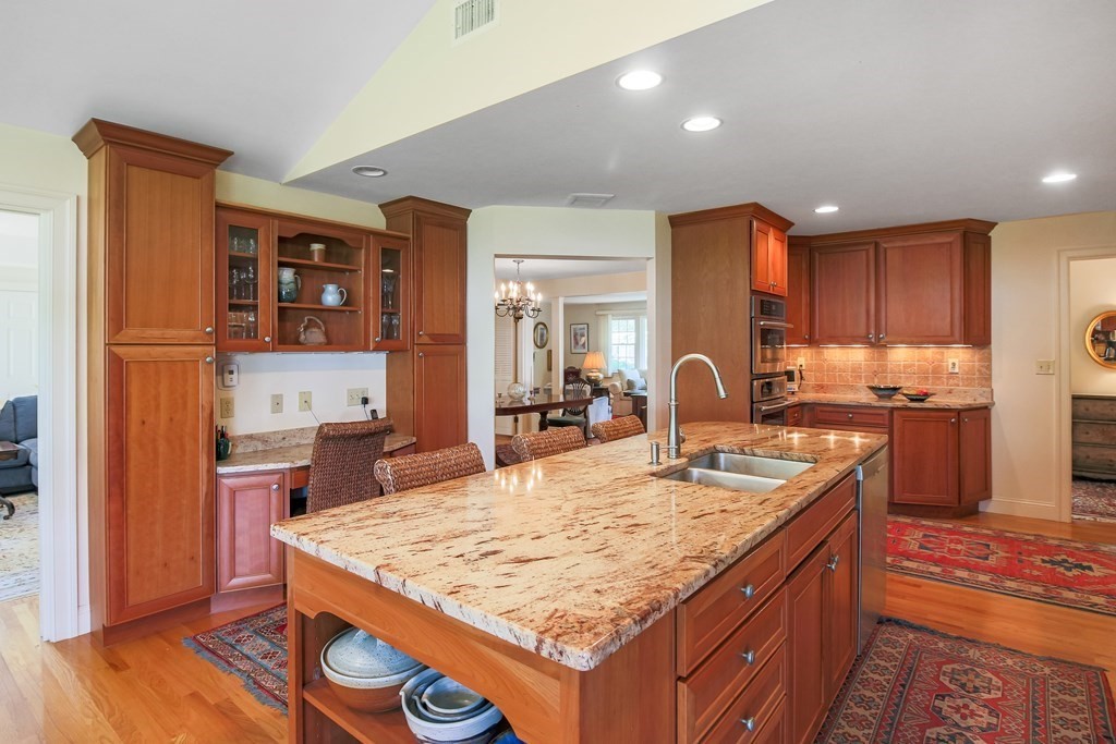 54 Ellis Drive Worcester, MA 01609 - Photo 24 of 42 a kitchen with stainless steel appliances granite countertop a sink stove and refrigerator