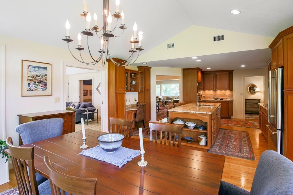 54 Ellis Drive Worcester, MA 01609 - Photo 26 of 42 a view of a dining room and livingroom with furniture wooden floor a chandelier