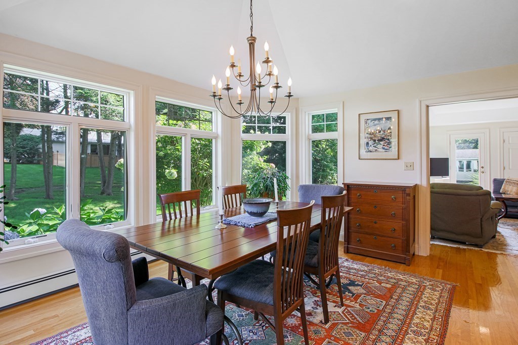 54 Ellis Drive Worcester, MA 01609 - Photo 27 of 42 a dining room with furniture a chandelier and wooden floor