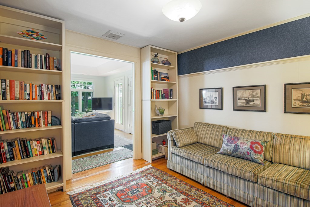 54 Ellis Drive Worcester, MA 01609 - Photo 29 of 42 a living room with furniture and a book shelf