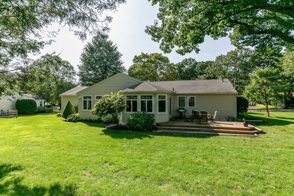 54 Ellis Drive Worcester, MA 01609 - Photo 3 of 42 a front view of a house with a yard table and chairs