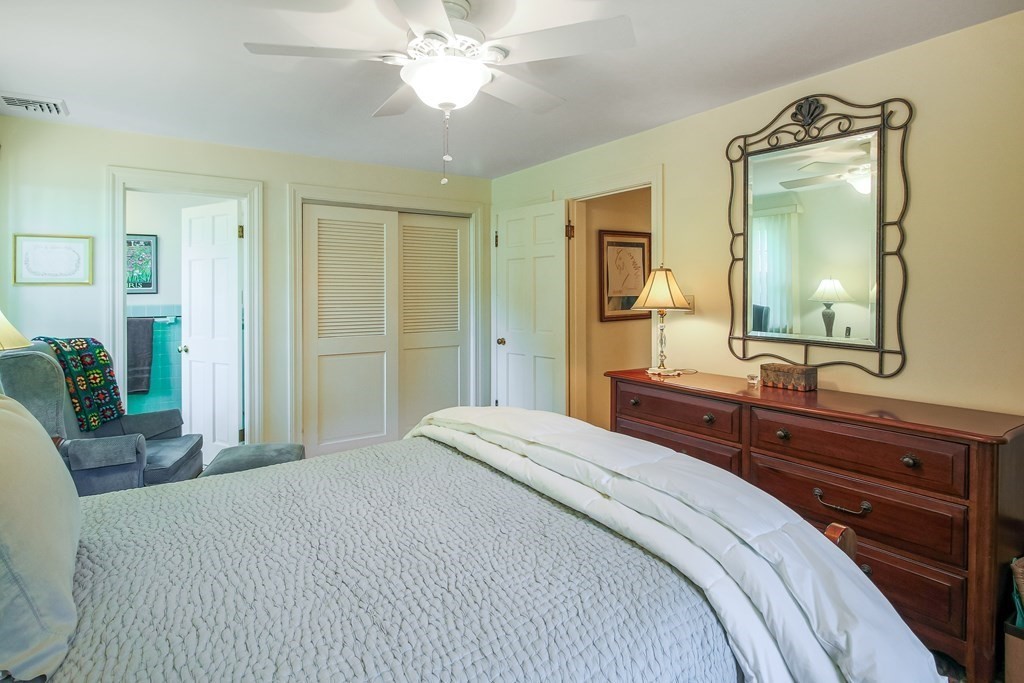 54 Ellis Drive Worcester, MA 01609 - Photo 33 of 42 a bedroom with a large bed and a mirror