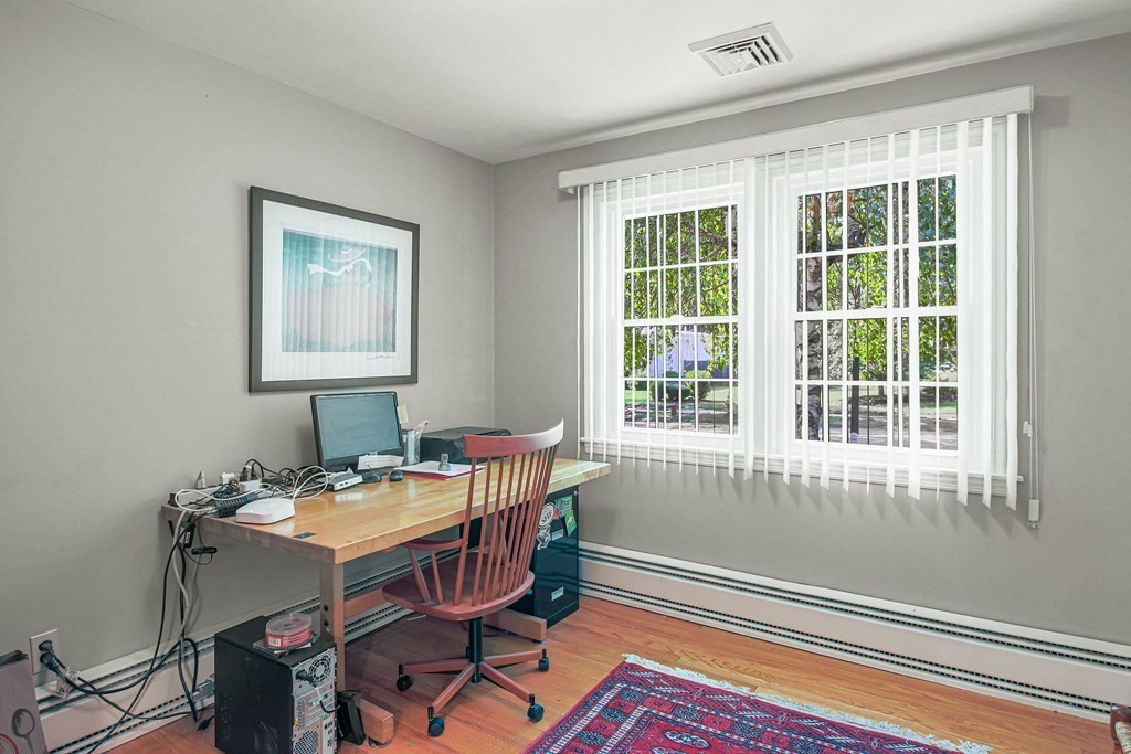 54 Ellis Drive Worcester, MA 01609 - Photo 38 of 42 a view of a workspace with furniture and a window