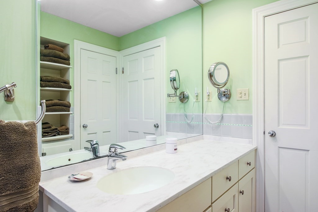 54 Ellis Drive Worcester, MA 01609 - Photo 40 of 42 a bathroom with a sink and a mirror