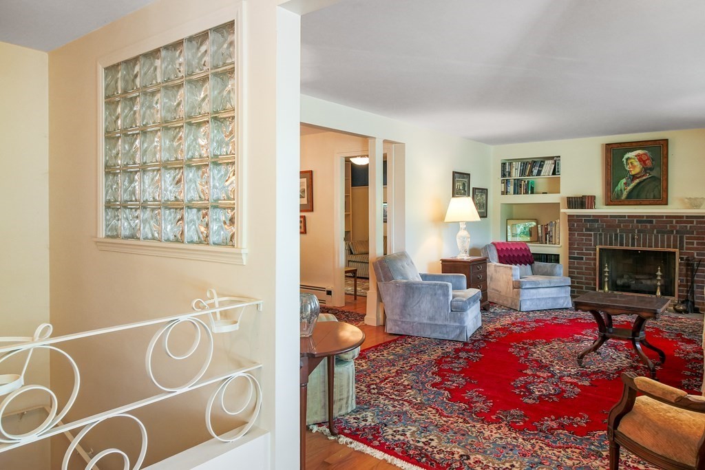 54 Ellis Drive Worcester, MA 01609 - Photo 7 of 42 a living room with furniture and a fireplace