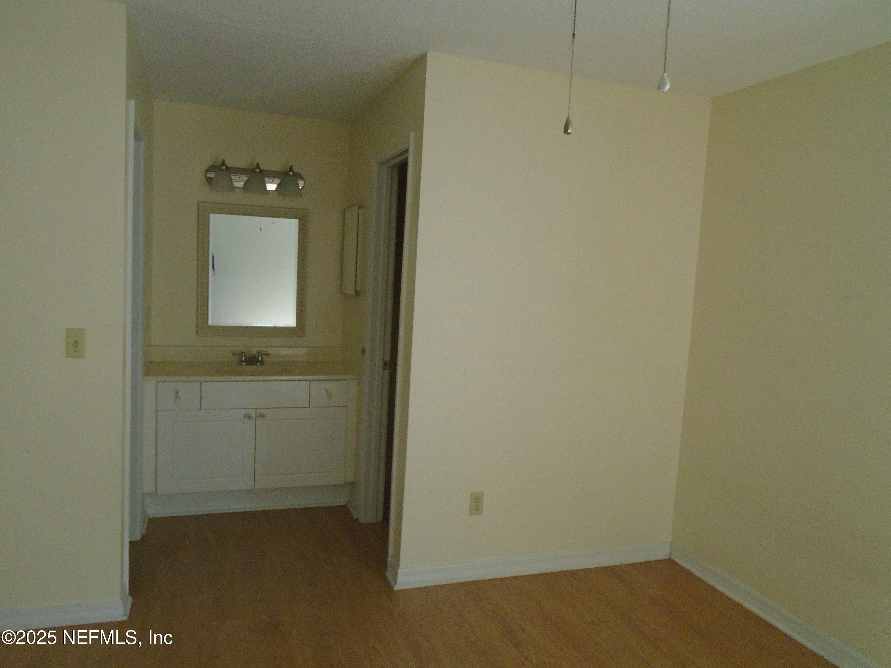 10200 Belle Rive Boulevard, Unit 163 Jacksonville, FL 32256 - Photo 13 of 13 a bathroom with a sink and a mirror