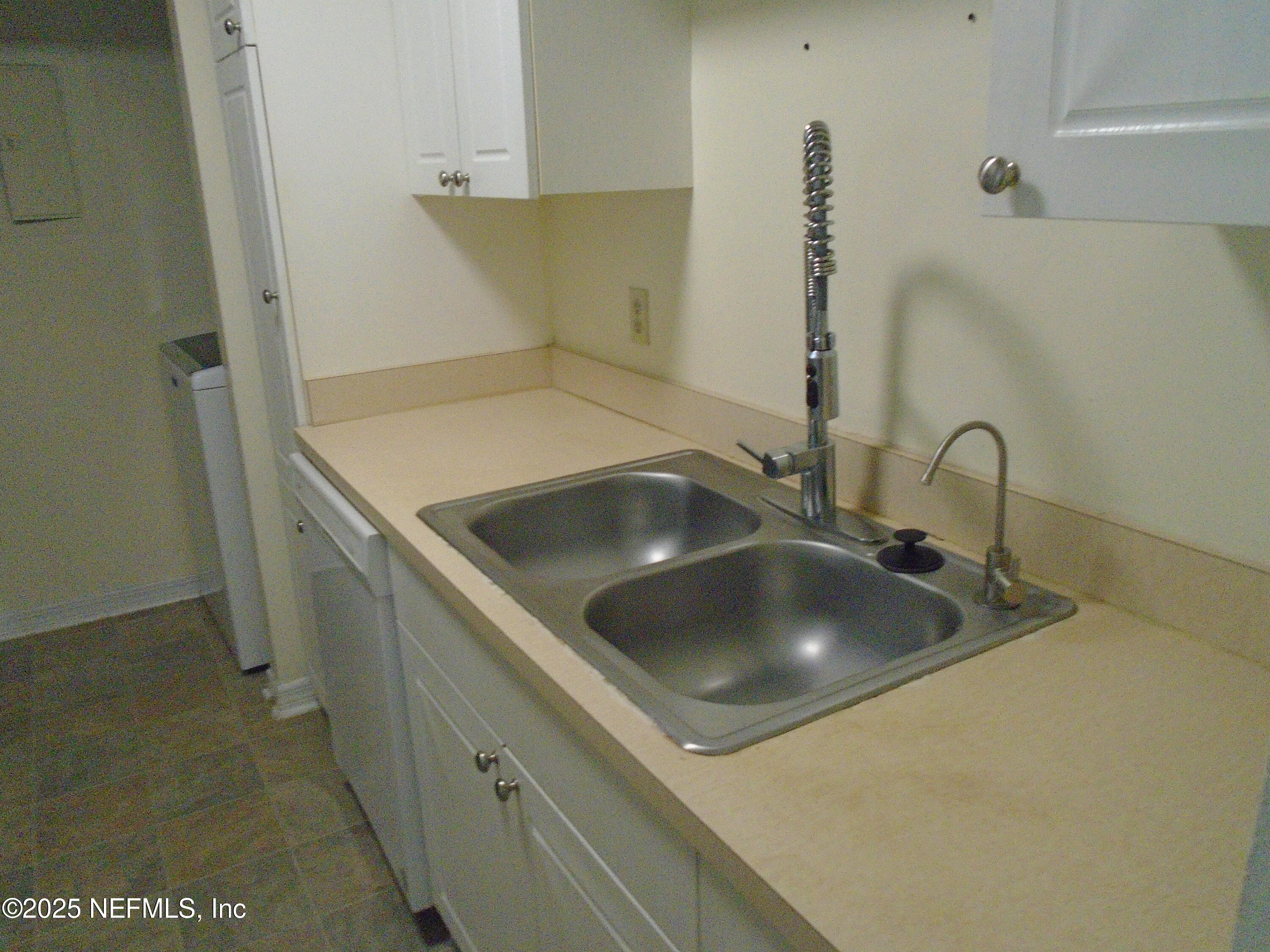 10200 Belle Rive Boulevard, Unit 163 Jacksonville, FL 32256 - Photo 3 of 13 a close view of sink and tap