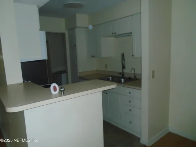 a bathroom with a sink and mirror
