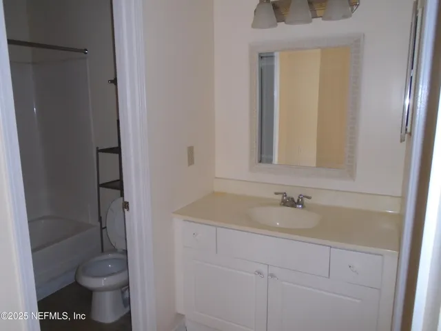 a bathroom with a sink and a toilet