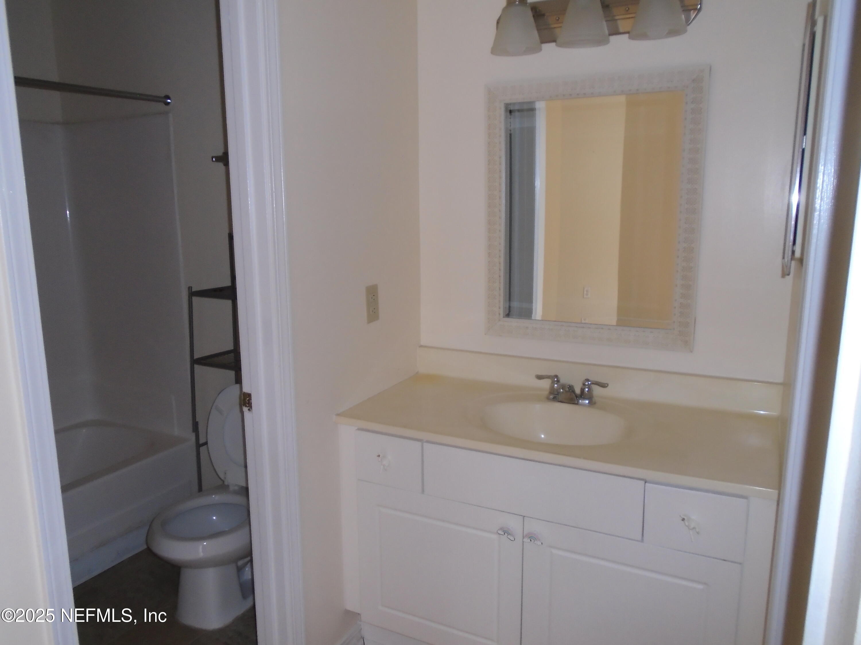 10200 Belle Rive Boulevard, Unit 163 Jacksonville, FL 32256 - Photo 8 of 13 a bathroom with a sink and a toilet