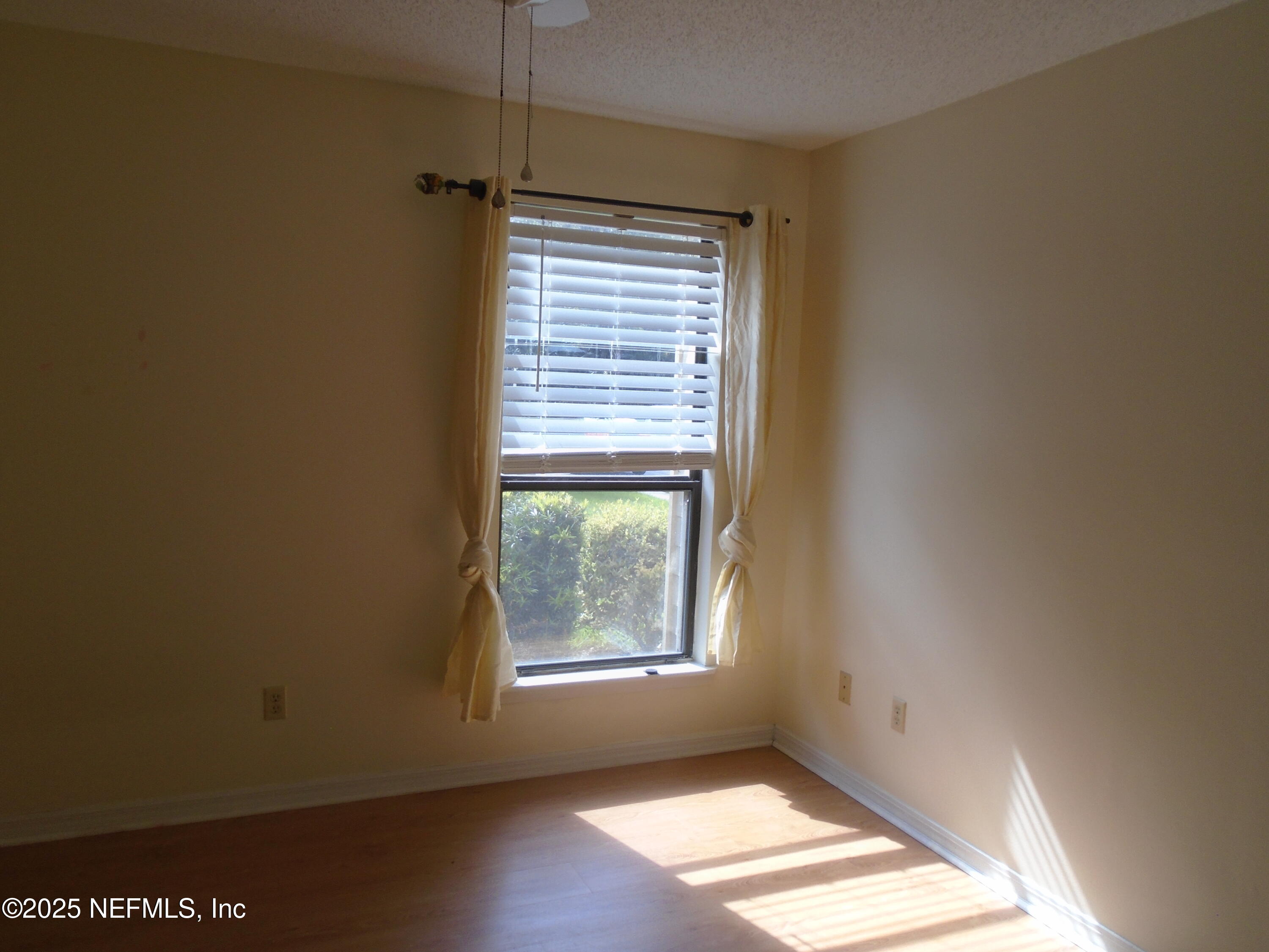 10200 Belle Rive Boulevard, Unit 163 Jacksonville, FL 32256 - Photo 10 of 13 a view of an empty room with a window