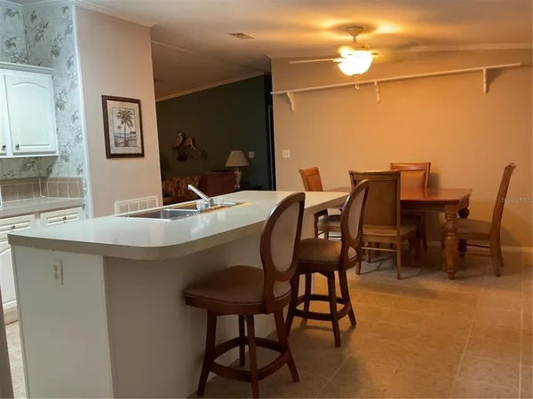 a view of kitchen with furniture and window