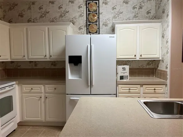 a bathroom with a sink toilet and mirror