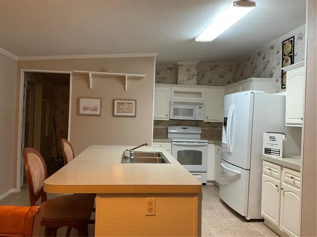 a lake view with boat and palm trees