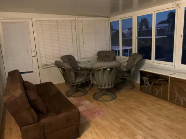 a bedroom with a bed and a chair