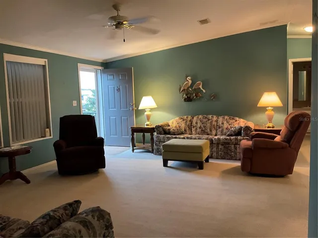 a kitchen with stainless steel appliances a refrigerator and a stove top oven