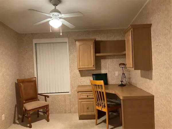 a view of kitchen with cabinets