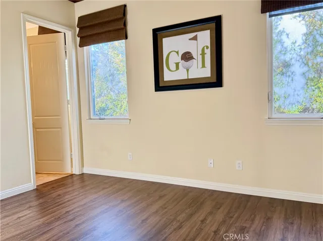 a view of an entryway with wooden floor