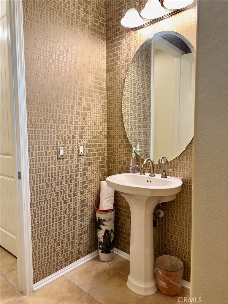 20318 West Vía Urbino Porter Ranch, CA 91326 - Photo 16 of 34 a bathroom with a sink and a mirror