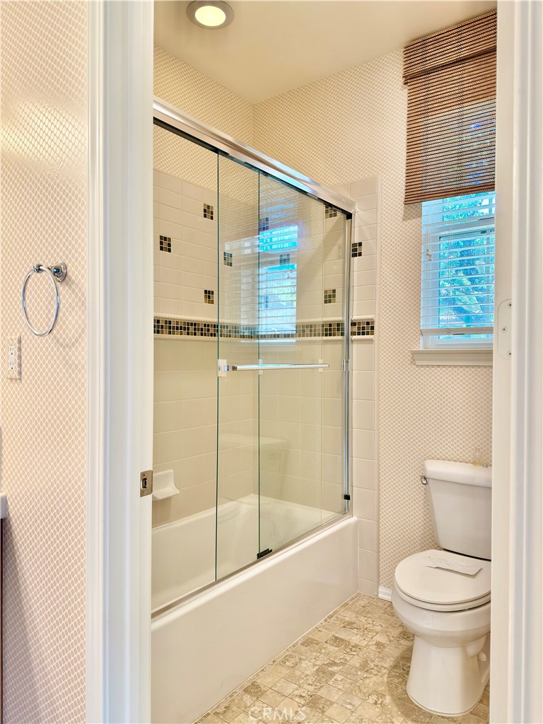 20318 West Vía Urbino Porter Ranch, CA 91326 - Photo 17 of 34 a bathroom with a shower and a toilet